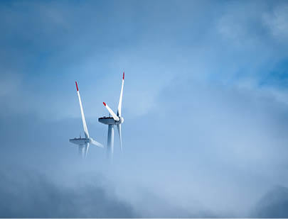 LOW ANGLE VIEW OF WINDMILL IN SKY